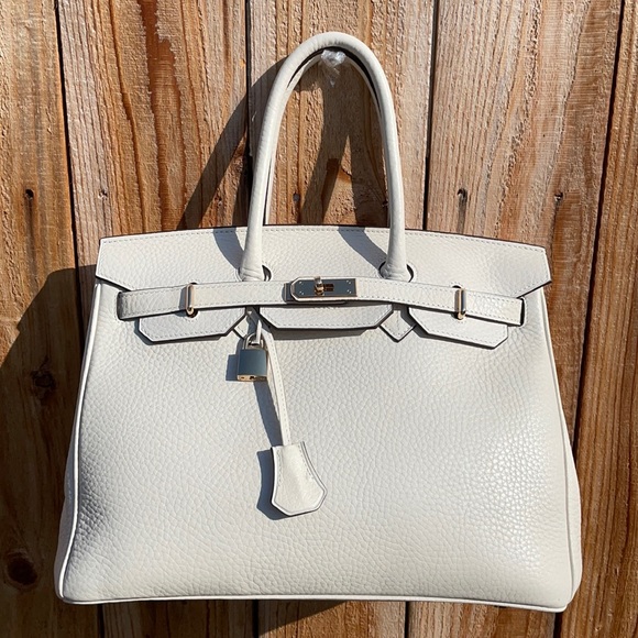 La Bottega Handbags - NWOT La Bottega Pebbled Leather Handbag in Ivory